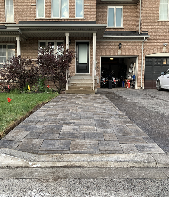 front yard and front porch covered with interlock