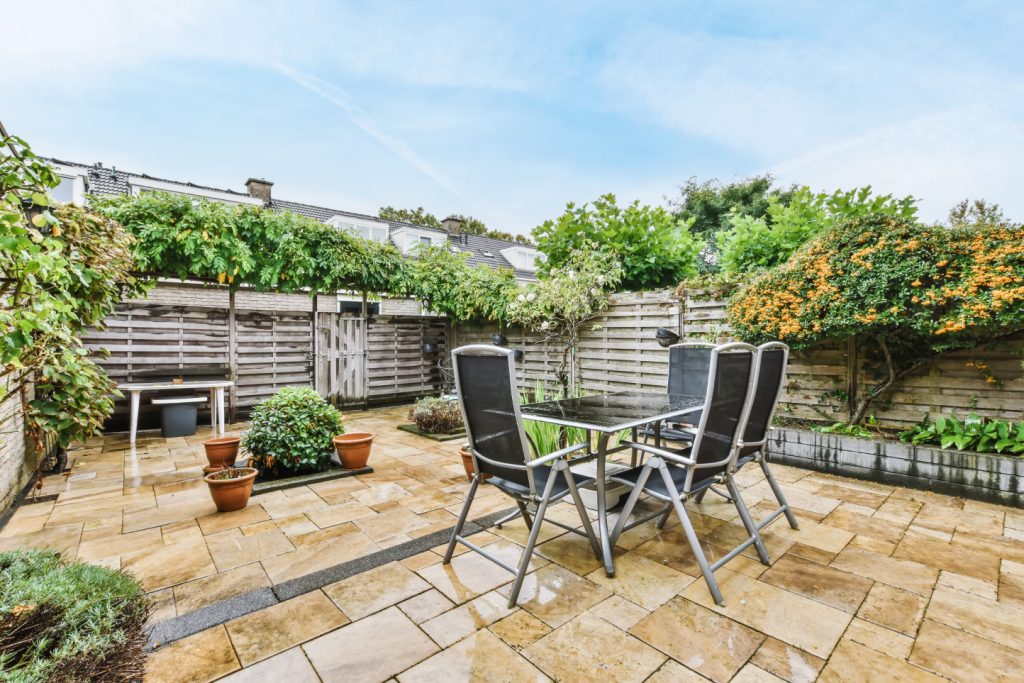 interlocking patio with light yellow stones, with a sitting area