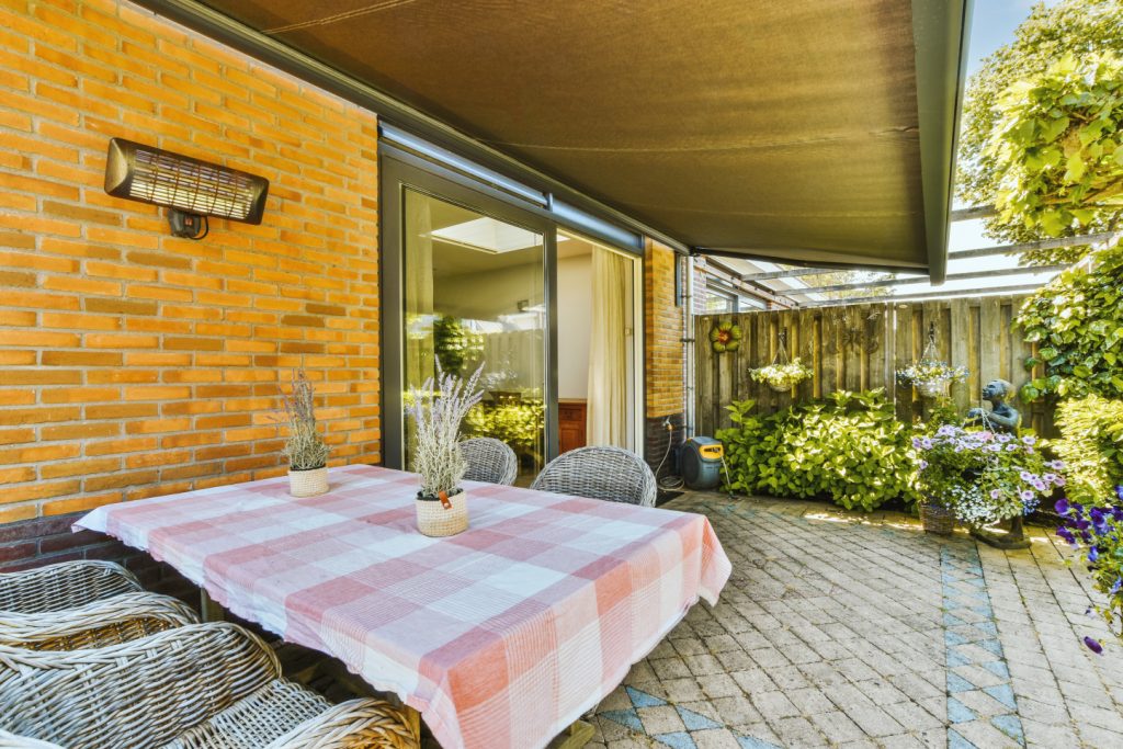 A wet interlocking patio with slate gray tiles